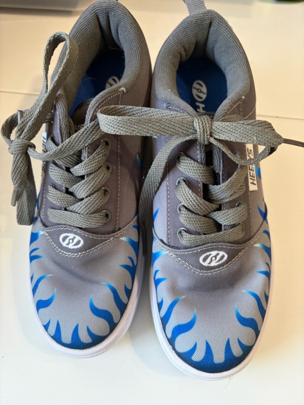 Youth size 5 gray/ blue flame Heelys